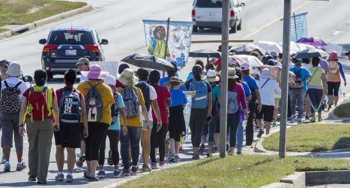 Participants in the "100 Women 100 Miles Pilgrimage" hit the road again after a lunch break on their walk near Elkridge, Maryland, after stopping at the University of Maryland Baltimore County on Sept. 20, 2015, on their way to Washington, D.C.