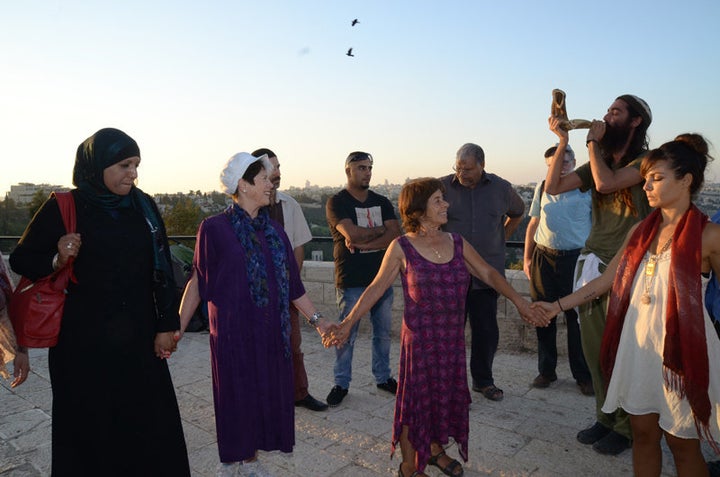 Two dozen people of various faiths gathered on Sept. 21, 2015, for a meeting and interfaith peace walk between the eastern and western parts of Jerusalem. Elana Rozenman, Abrahamic Reunion co-founder and founder of TRUST-Emun, appears second from left.