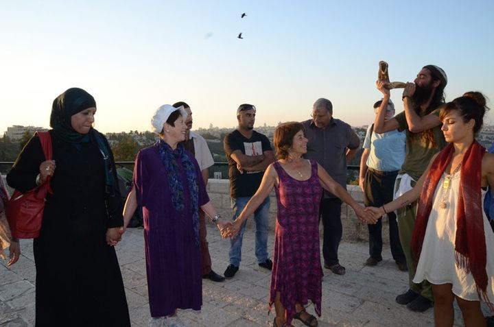 Two dozen people of various faiths gathered on Sept. 21, 2015, for a meeting and interfaith peace walk between the eastern and western parts of Jerusalem. Elana Rozenman, Abrahamic Reunion co-founder and founder of TRUST-Emun, appears second from left.