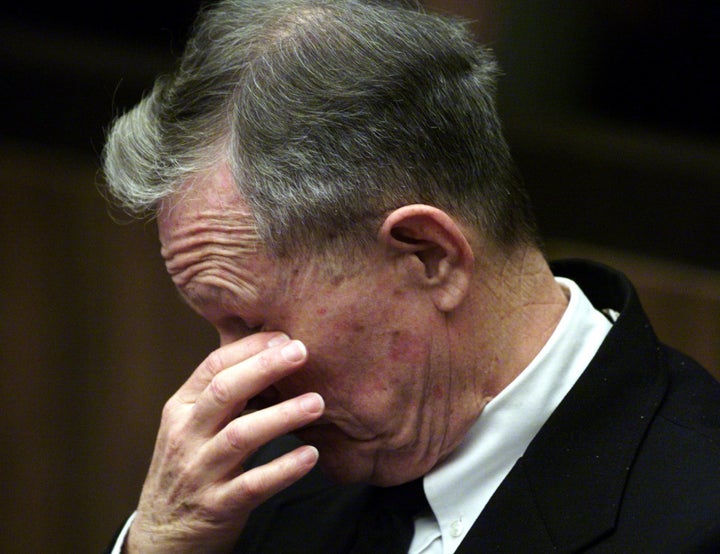 Roman Catholic priest John Geoghan listens to Judge Sandra Hamlin at Middlesex Superior Court in Cambridge, Massachusetts, 21 February, 2002. Geoghan was sentenced to 10 years in jail for having sexually abused a 10-year-old boy in 1991.