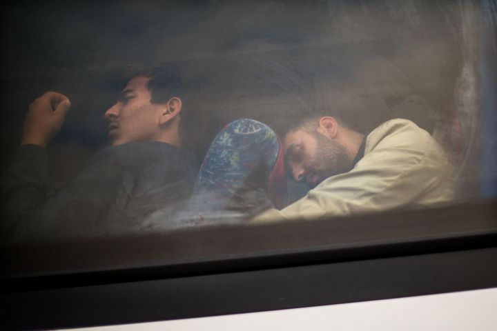 People sleep in a bus outside a refugee transit camp in Opatovac, Croatia, on Sept. 24, 2015. Croatia noted that it could not cope with the increasing number of migrants entering the country and demanded that Serbia transport them to Hungary and Romania.