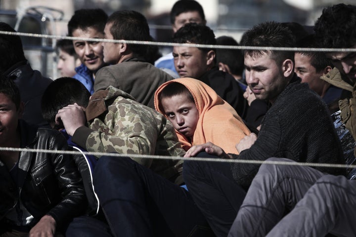 Refugees arrive on a Hellenic Coast Guard ship at the island of Lesbos. Since Greece bolstered controls along its land border with Turkey along the Evros river, migrants and refugees have turned to the maritime route between Turkey and the Greek islands. 