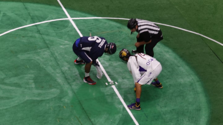 Jeremy Thompson of the Iroquois Nationals takes the faceoff against Team USA's CJ Costabile