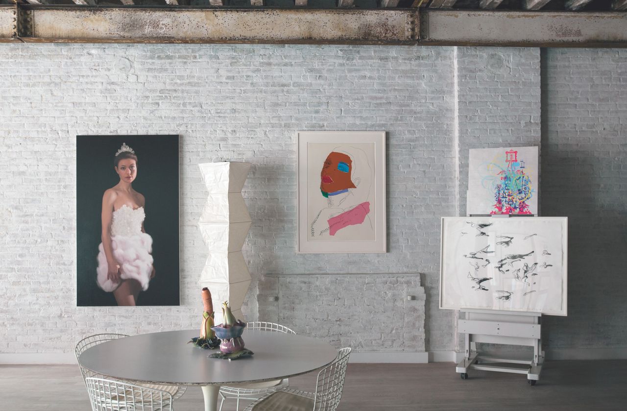 The home of Will Cotton: Cotton's 2010 painting of his partner, Rose Dergan, coexists with works by Andy Warhol and Ryan McGinness. Ceramics by artist Linda Lighton, who happens to be Dergan's mother, are on the table.