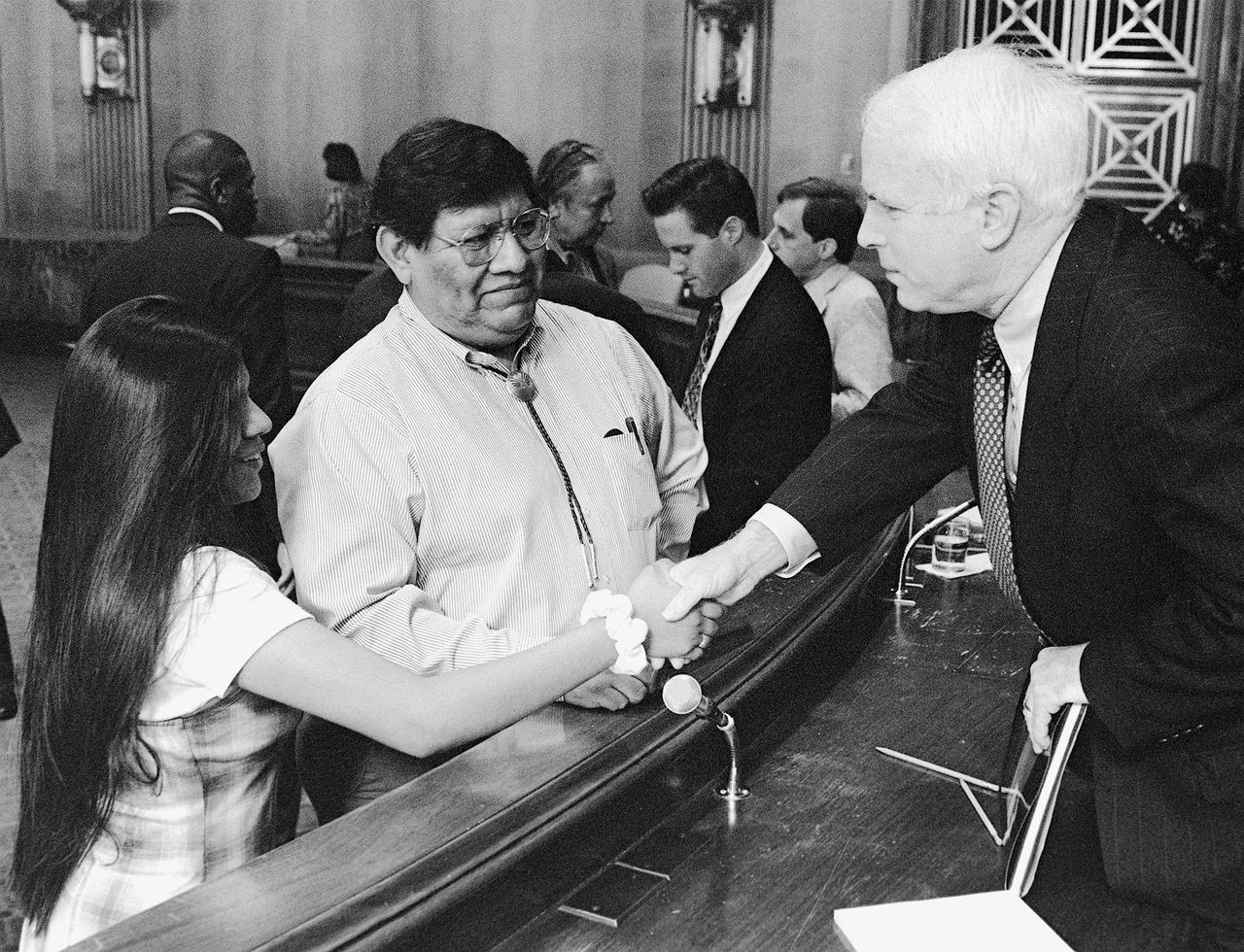 John McCain shakes hands with a young Tohono O'Odham tribal member at a Senate Committee on Indian Affairs meeting.
