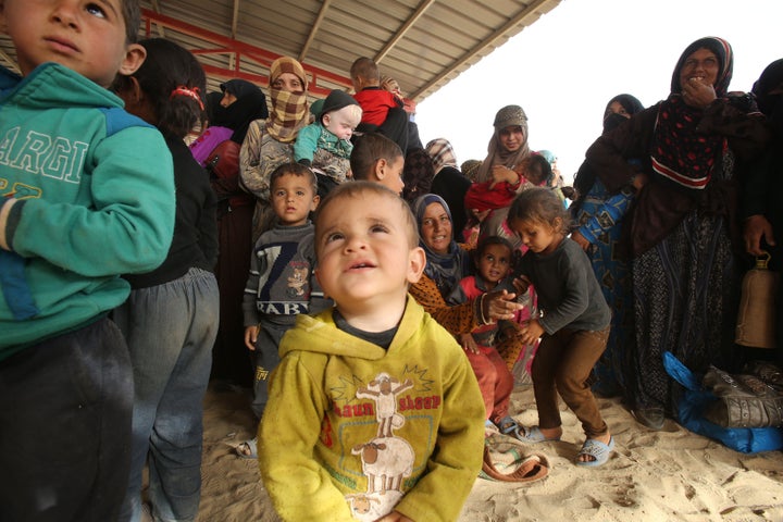 Syrian refugees arrive at the area of Al-Roqban in the desert north-east Jordan, at the border with both Syria and Iraq, on S