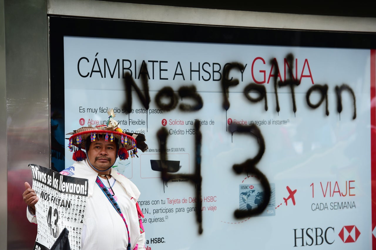 Some protesters held signs reading "Nos faltan 43," Spanish for 'We are missing 43."