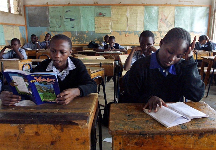 Kenyan children learn by their own in a classroom during a teacher strike.