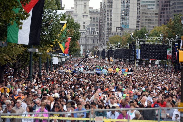People listen as Pope Francis speaks during an open-air mass at the Benjamin Franklin Parkway in Philadelphia, Pennsylvania,
