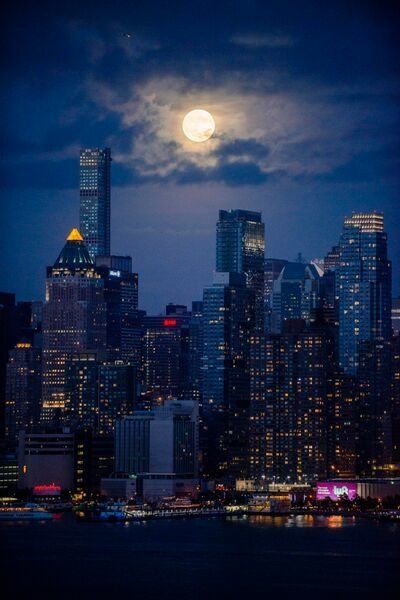 After some waiting and worrying we wouldn't see the supermoon because of the dense cloud cover my son and I saw it break through the heavy gray backdrop over NYC. Images were taken from the cliff on Lincoln Place street in Weehawken NJ.