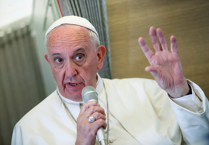 Pope Francis talks aboard the papal plane while en route to the United States on September 22, 2015.