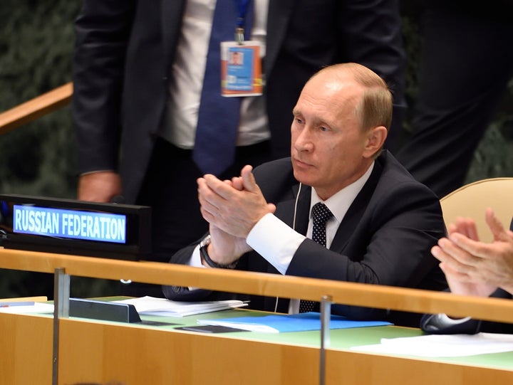 Russian President Vladimir Putin applauds during Xi's speech at the United Nations General Assembly. 