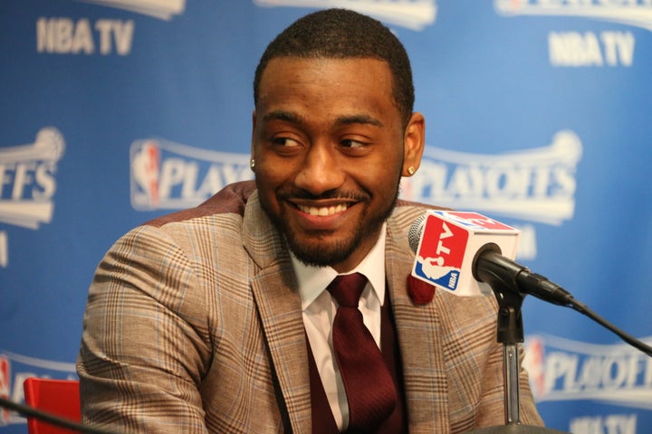 John Wall #2 of the Washington Wizards speaks to the media after the game against the Atlanta Hawks in Game Six of the Eastern Conference Semifinals of the 2015 NBA Playoffs at the Verizon Center on May 15, 2015 in Washington, DC.