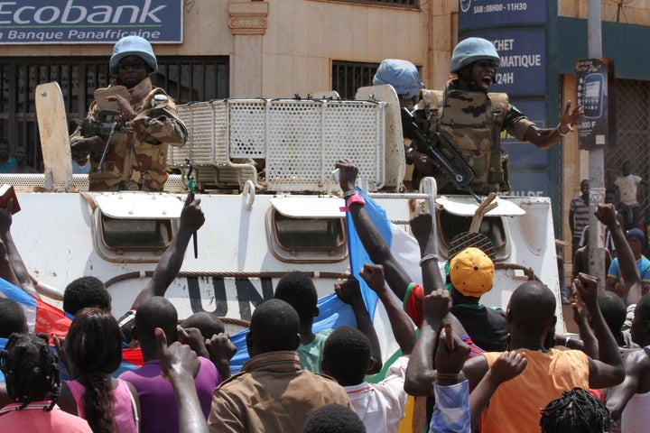 Demonstrators in the Central African Republic demand interim President Catherine Samba-Panza's resignation on Sept. 28, 2015, shortly after a young motorcycle taxi driver was found dead in the capital, Bangui.