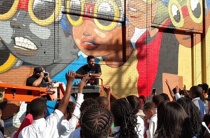 Artist Hebru Brantley speaks to fourth-graders about the mural he painted in Detroit.