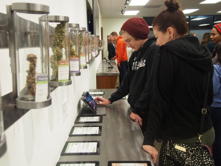 Customers check out strains of marijuana at Shango dispensary in Portland on Oct. 1, 2015.