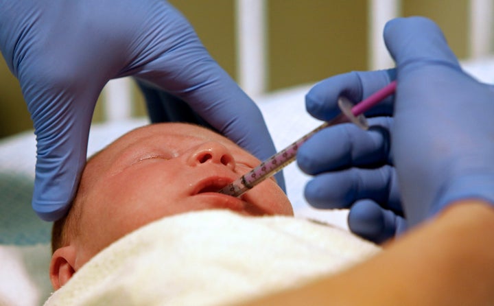 A baby receives a dose of morphine at East Tennessee Children's Hospital in Knoxville, Tennessee.