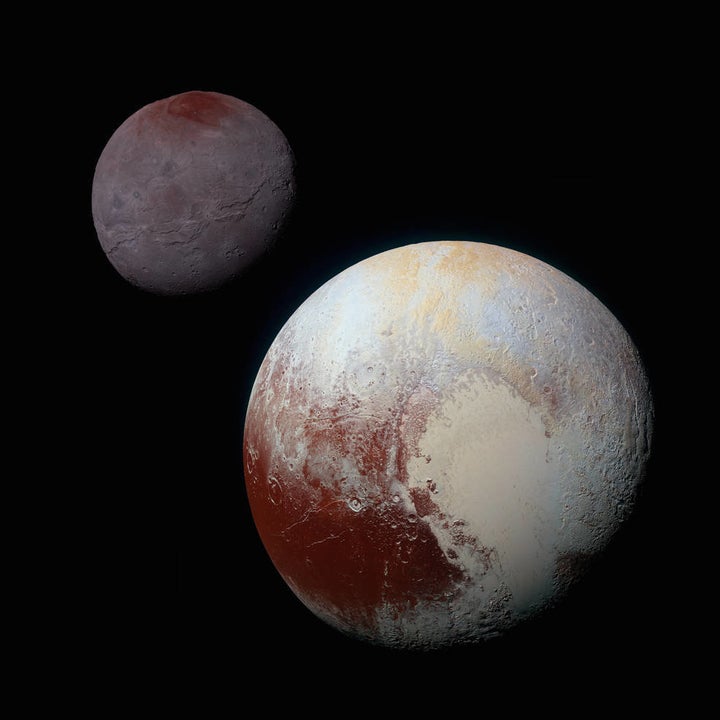 This composite of enhanced-color images of Pluto (lower right) and Charon (upper left) was taken by NASA's New Horizons spacecraft on July 14, 2015. The image highlights the striking differences between Pluto and Charon. Pluto and Charon are shown with approximately correct relative sizes, but their separation is not to scale.