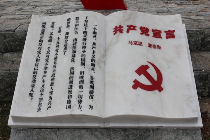 The theme park features a sculpture of the "Communist Manifesto."