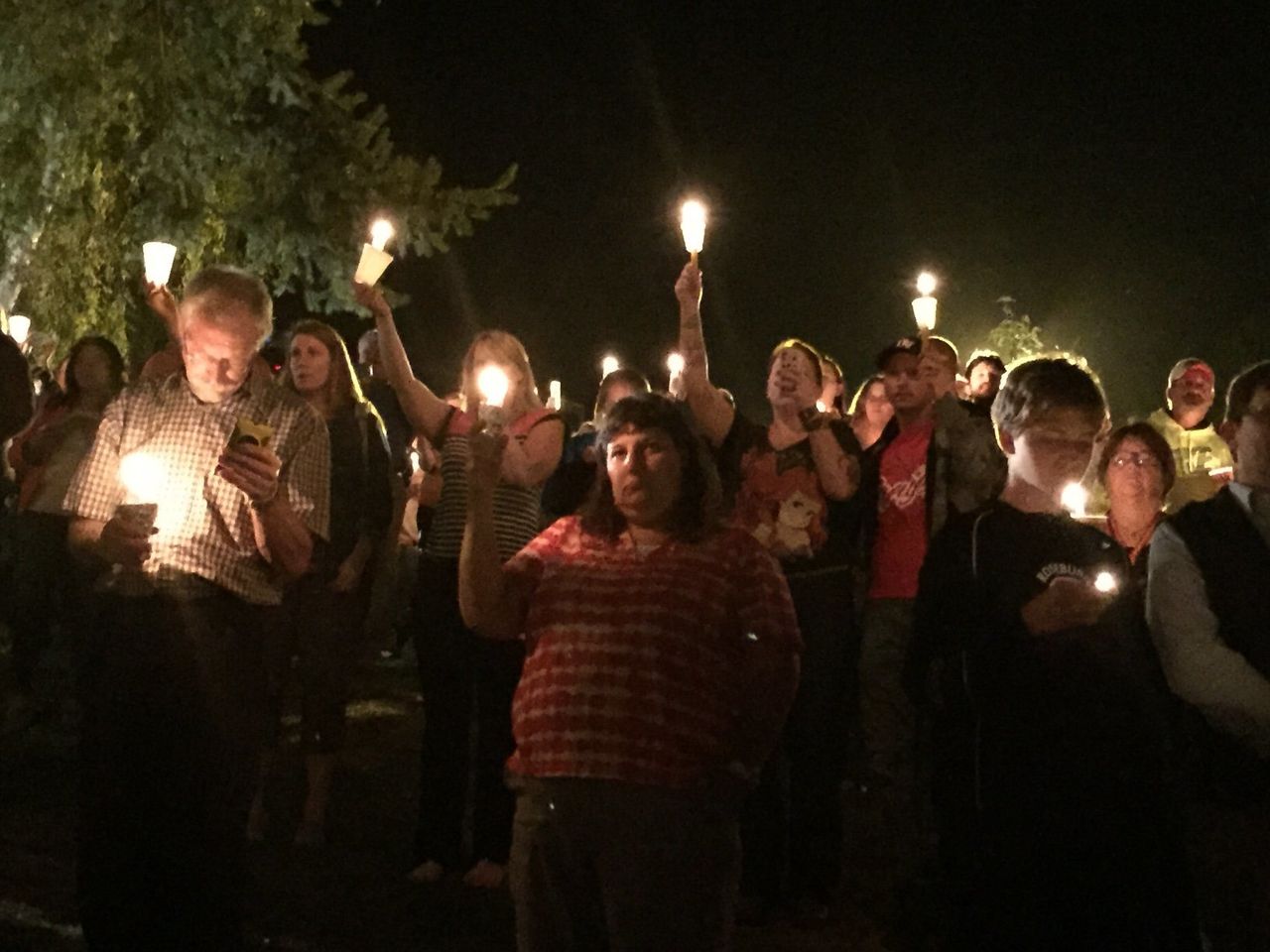Members of the Roseburg, Oregon community gather for a vigil following a horrific shooting at Umpqua Community College.