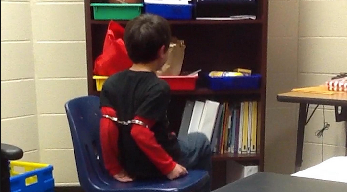 Images of a child being handcuffed at a Kentucky school went viral this year. The Kenton County Sheriff's Office is being sued for violating the rights of two children who were disciplined this way.