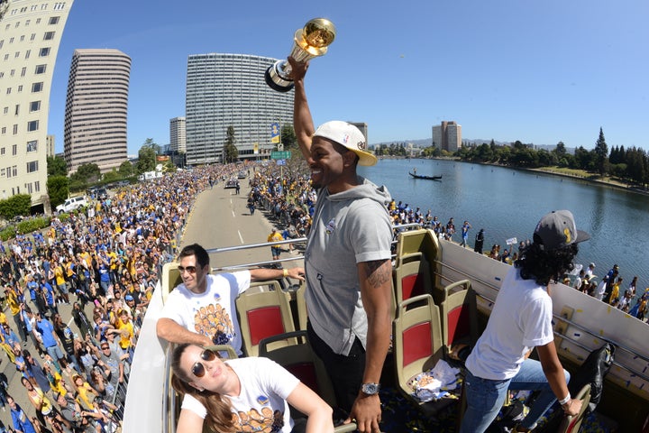 Golden State Warrior Andre Iguodala celebrates winning the Bill Russell Finals MVP award and the 2015 NBA title during his team's championship parade last June.