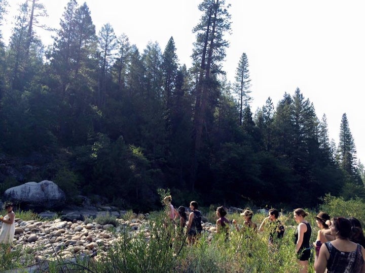Sweet Water Women's Retreat participants process to the river for the weekend's opening ceremony. They meditated and made offerings to the goddess, Oshun.