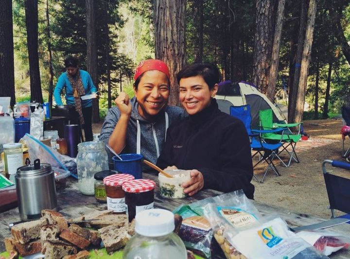 Dalila Mendez, left, and Andrea Penagos, right, enjoy a bountiful breakfast before a day of activity at the Sweet Water Women's Retreat.