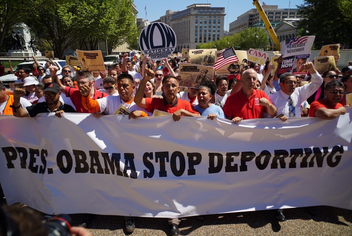 Immigrant rights activist march on Pennsylvania Avenue as they arrive at the White House on Aug. 28, 2014, in Washington, D.C.