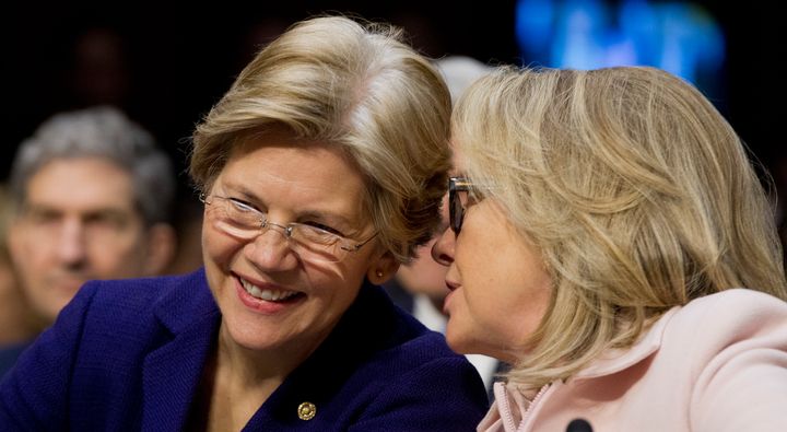 Sen. Elizabeth Warren (D-Mass.) and former Secretary of State Hillary Clinton talk on Jan. 24, 2013. 