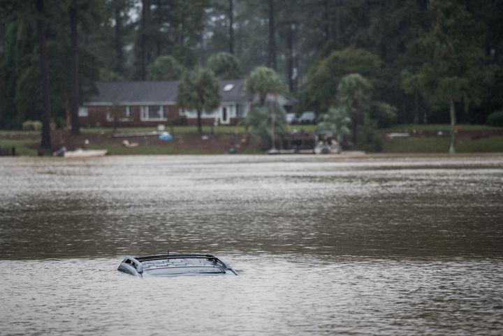 COLUMBIA, SC - OCTOBER 5: A vehicle floats in a small lake in the Forest Acres neighborhood October 5, 2015 in Columbia, South Carolina. The state of South Carolina experienced record rainfall amounts over the weekend which stranded motorists and residents and forced hundreds of evacuations and rescues. (Photo by Sean Rayford/Getty Images)