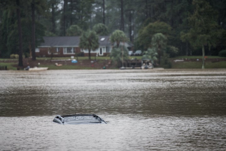 COLUMBIA, SC - OCTOBER 5: A vehicle floats in a small lake in the Forest Acres neighborhood October 5, 2015 in Columbia, Sout