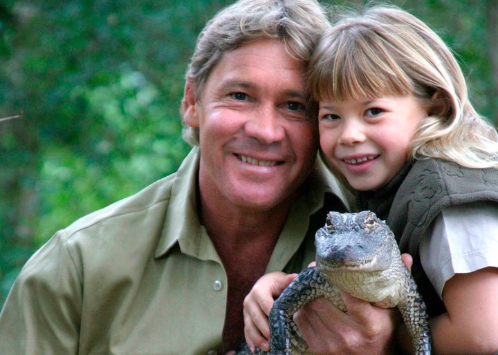 Bindi poses with her father and "Russ" the alligator at Australia Zoo in June 2005.