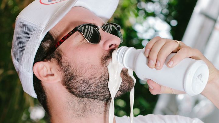 Man with drinking problem enjoying Soylent with his mouth apparently closed.