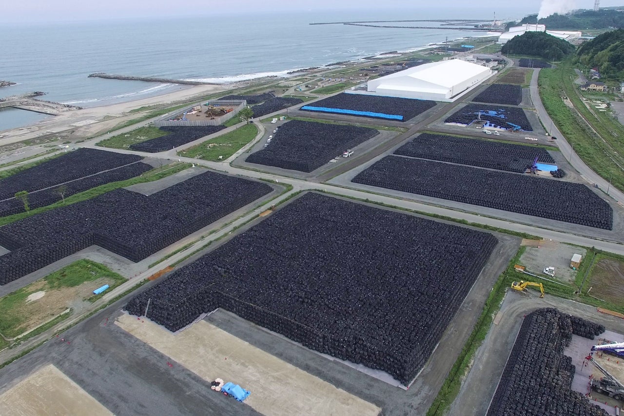 An aerial photograph taken by a drone of dump sites with sacks of contaminated radioactive soil. To save space they are stacked in layers, one on top of the other.