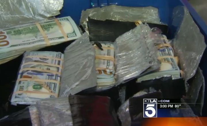 The money was excavated from beneath a patch of trees in the former home of Cesar Yanez, in Fontana, California.