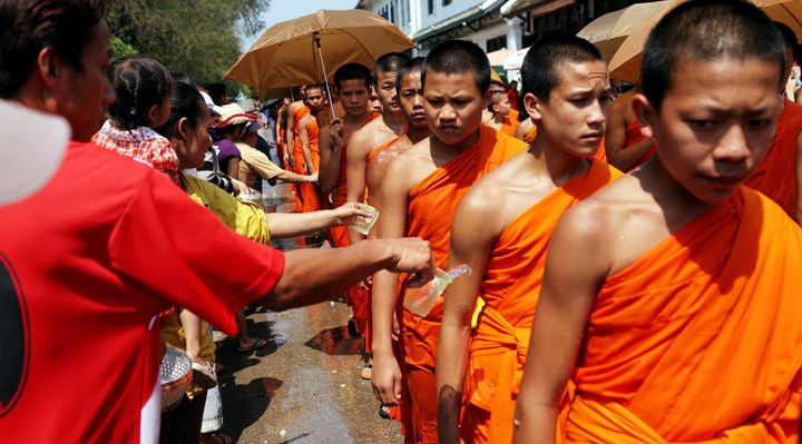 Devotees splash water on Buddhist monks during the Songkran festival in Luang Prabang, Laos, in April 2008. Homosexuality is not criminalized in the communist country, but laws and policies are silent on LGBT issues.
