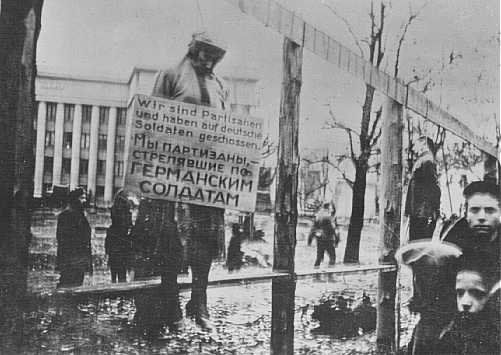 Masha Bruskina, a Jewish partisan executed by the Nazis, was hanged wearing a sign stating, "We are partisans and have shot at German soldiers." Minsk, October 1941.