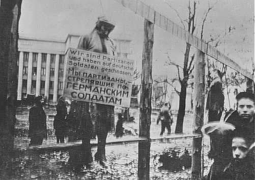 Masha Bruskina, a Jewish partisan executed by the Nazis, was hanged wearing a sign stating, "We are partisans and have shot at German soldiers." Minsk, October 1941.