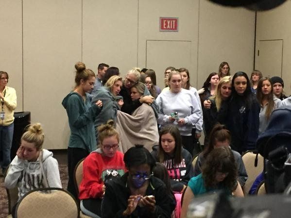 Students comfort each other at a press conference at Northern Arizona University following a shooting where 1 student was killed and 3 people were injured.