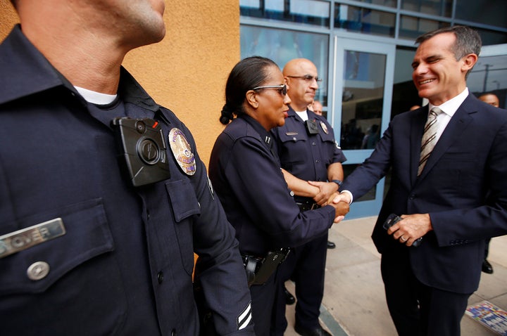 Los Angeles Mayor Eric Garcetti shakes hands with LAPD officers who are wearing the department's new body cameras on Sept. 4, 2015.