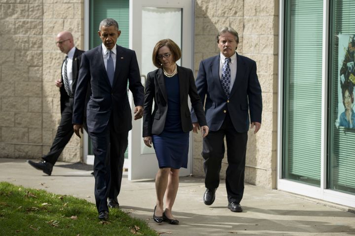 President Barack Obama, Oregon Governor Kate Brown and Roseburg Mayor Larry Rich leave a meeting with the families of the Umpqua College shooting victims on October 9, 2015 in Roseburg, Oregon.