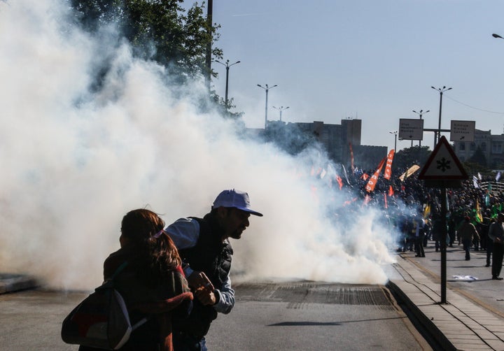 Turkish security forces use tear gas at the blast site in Ankara, Oct. 10, 2015.