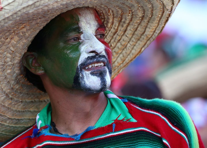 A Mexican fan wears his team's colors to show support during the 2017 FIFA Confederations Cup Qualifying match between Mexico and the United States