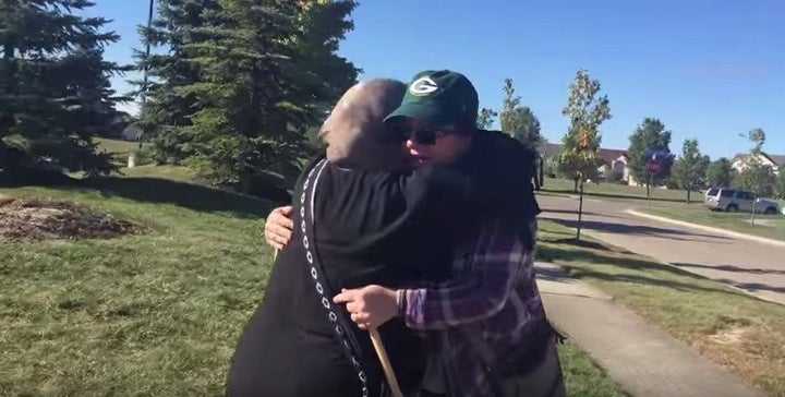 Cynthia DeBoutinkhar gives a protestor a hug outside an Islamic cultural center in Ohio.