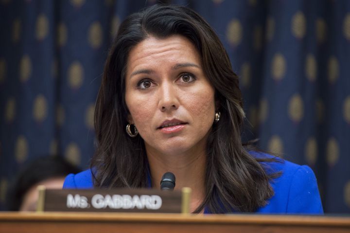Rep. Tulsi Gabbard (D-Hawaii) says she was disinvited from Tuesday's debate, while the DNC says she was just asked to keep the focus on the candidates.