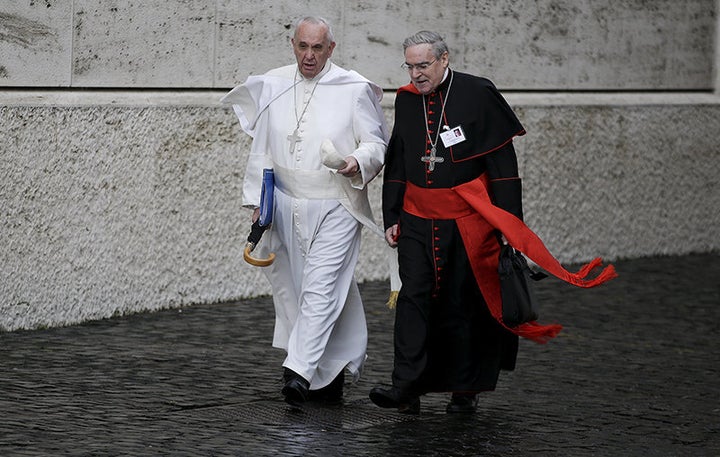 Pope Francis talks with Spanish cardinal Lluis Martinez Sistach as he arrives to lead the synod of the family at the Vatican,