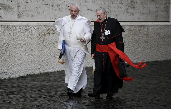 Pope Francis talks with Spanish cardinal Lluis Martinez Sistach as he arrives to lead the synod of the family at the Vatican, on October 10, 2015. 