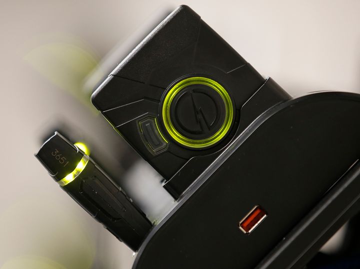 A Taser Axon Flex body camera and battery are seen in a charging and data downloading port. Police officers in Orlando used these devices as part of a yearlong study on body cameras.