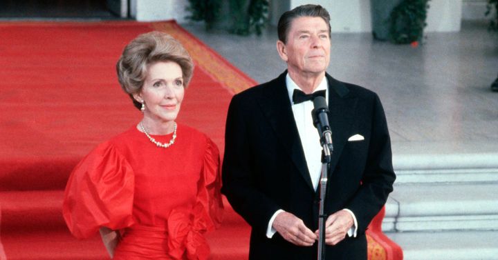 First lady Nancy Reagan and President Ronald Reagan greet the press outside the White House in May 1981.